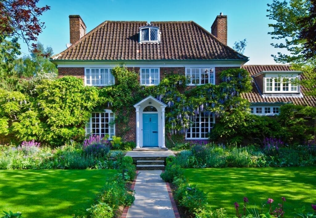 English house with beautiful path in front lawn