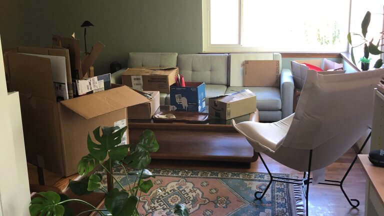 Packing up living room with boxes
