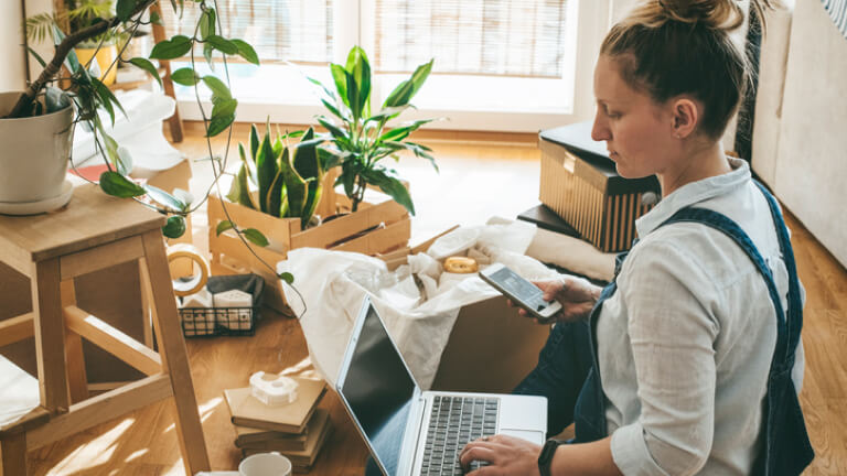 Young woman moving in into new apartment