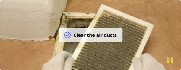 Man removes dust ventilation grilles