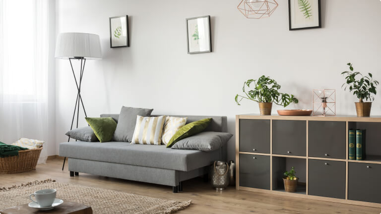 Living room with sofa, lamp and rack