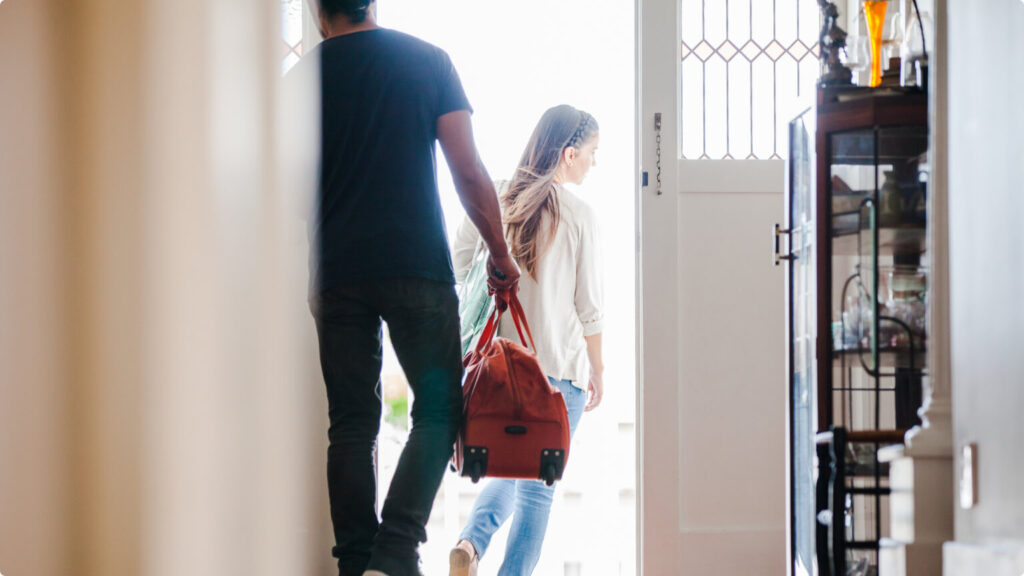 Family going for travel with bags in hand leaving home