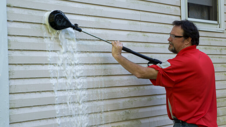 Using A High Pressure Brush To Clean Algae And Mold