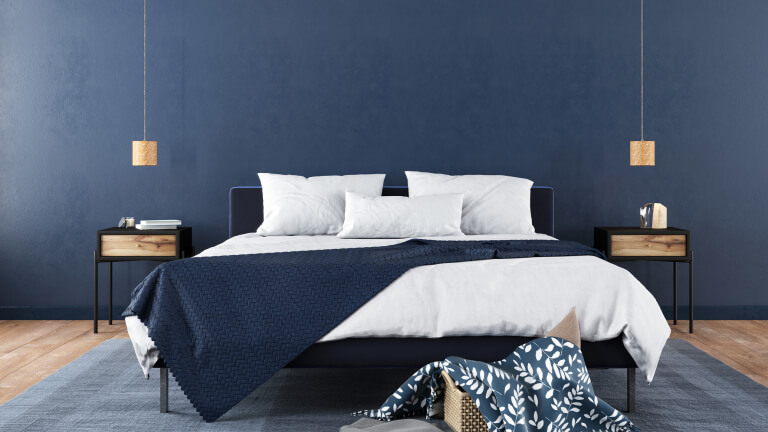 Stylish bedroom interior in trendy blu