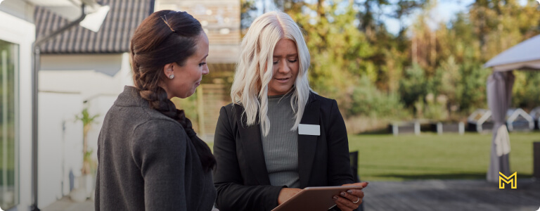 Estate agent talking to client